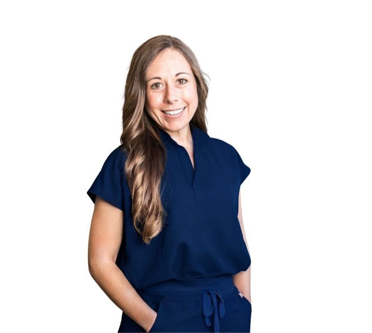 Dr. Katherine Rodriguez-Feo, pediatric dentist, smiling in navy scrubs, promoting healthy smiles for children at Fairhope Children's Dentistry.