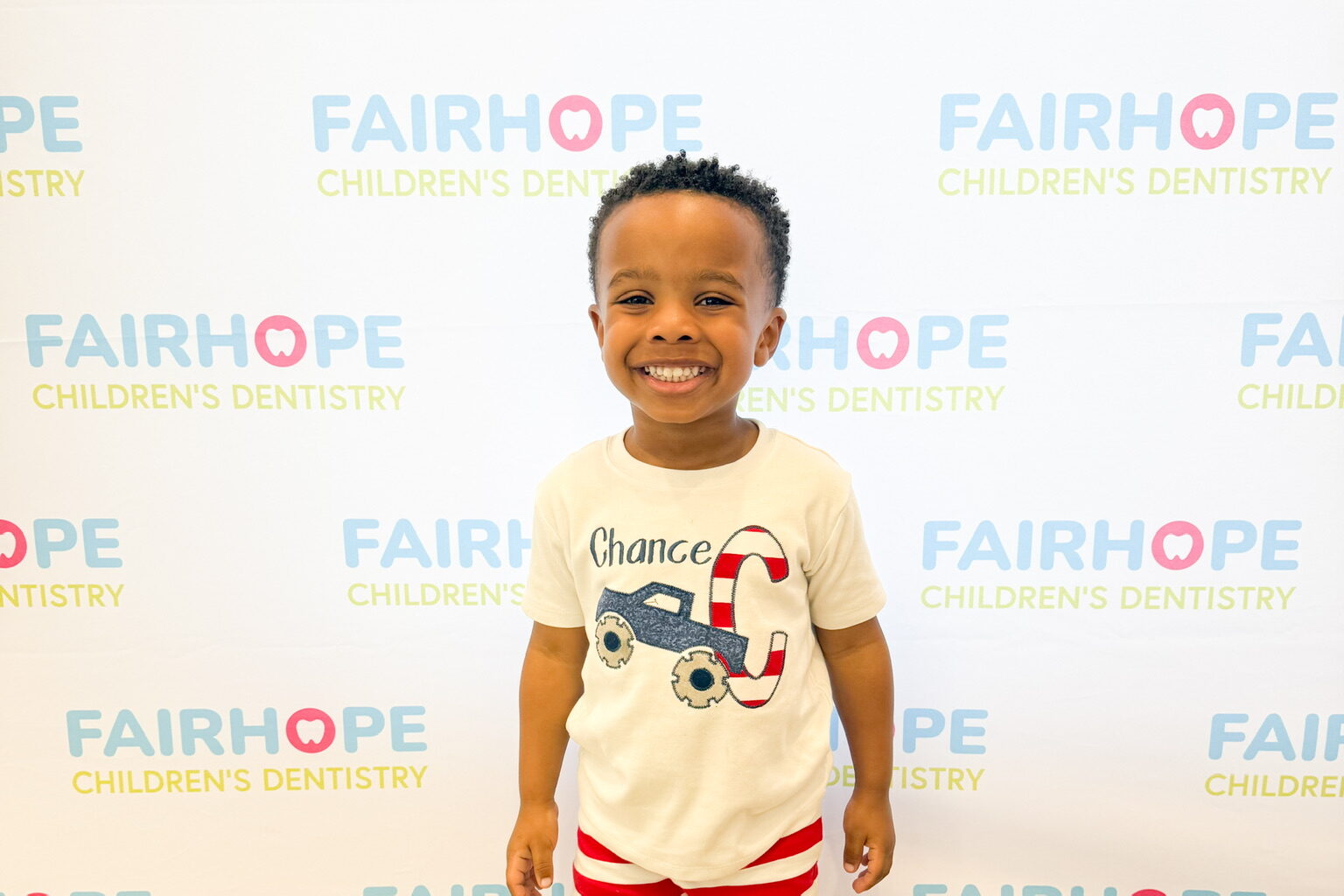 Smiling child at Fairhope Children's Dentistry, showcasing healthy teeth and a welcoming environment.